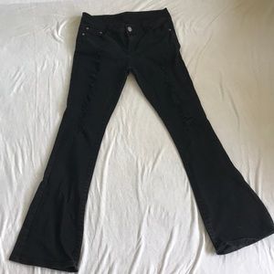 Black distressed mid rise jeans.